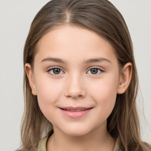 Joyful white child female with long  brown hair and brown eyes