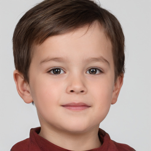 Joyful white child male with short  brown hair and brown eyes