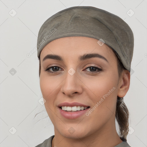 Joyful white young-adult female with medium  black hair and brown eyes