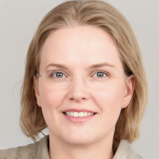 Joyful white young-adult female with medium  brown hair and blue eyes