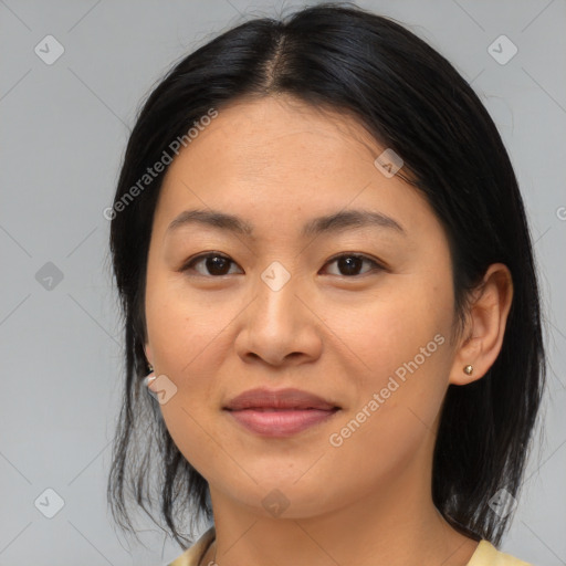 Joyful asian young-adult female with medium  brown hair and brown eyes