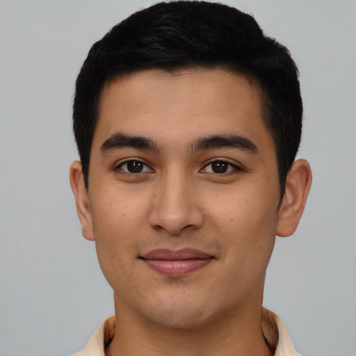 Joyful asian young-adult male with short  black hair and brown eyes