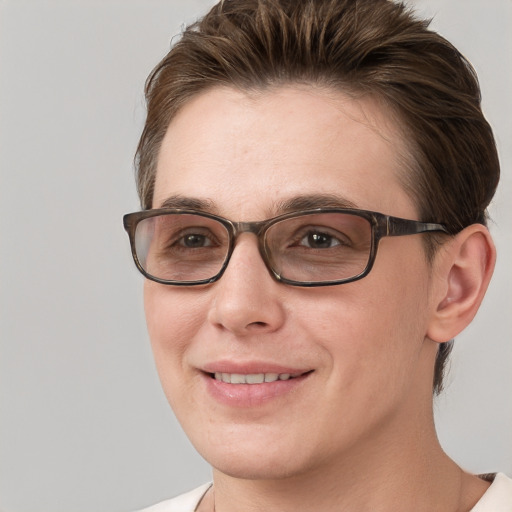 Joyful white young-adult female with short  brown hair and grey eyes