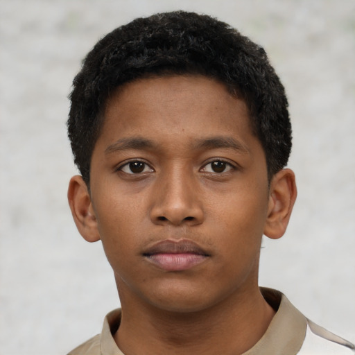 Neutral black young-adult male with short  black hair and brown eyes