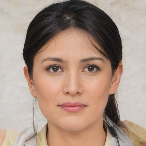 Joyful white young-adult female with medium  brown hair and brown eyes