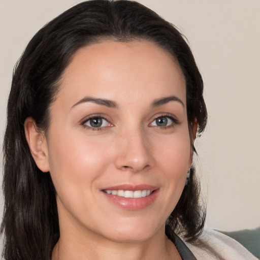 Joyful white young-adult female with medium  brown hair and brown eyes