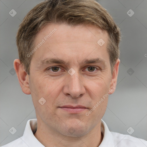 Joyful white adult male with short  brown hair and grey eyes