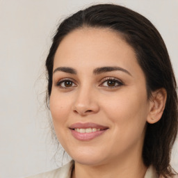 Joyful white young-adult female with medium  brown hair and brown eyes