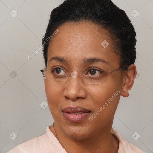 Joyful black adult female with short  brown hair and brown eyes