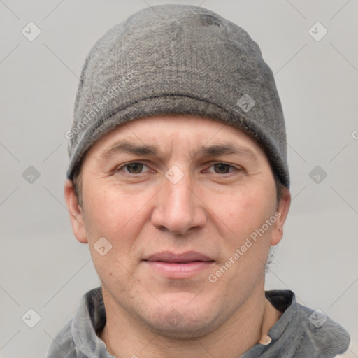 Joyful white adult male with short  brown hair and grey eyes