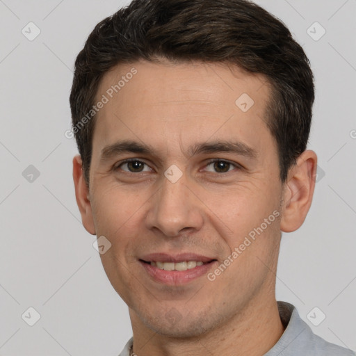 Joyful white adult male with short  brown hair and brown eyes