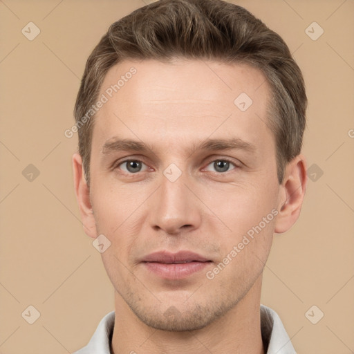 Joyful white adult male with short  brown hair and brown eyes