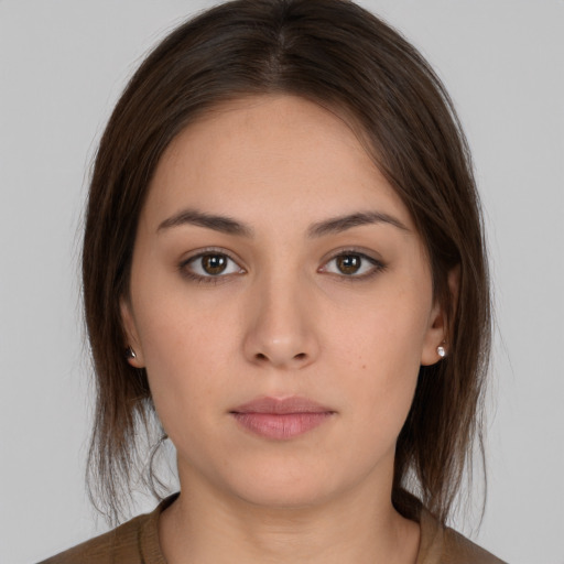 Neutral white young-adult female with medium  brown hair and brown eyes