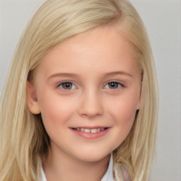 Joyful white child female with medium  brown hair and brown eyes
