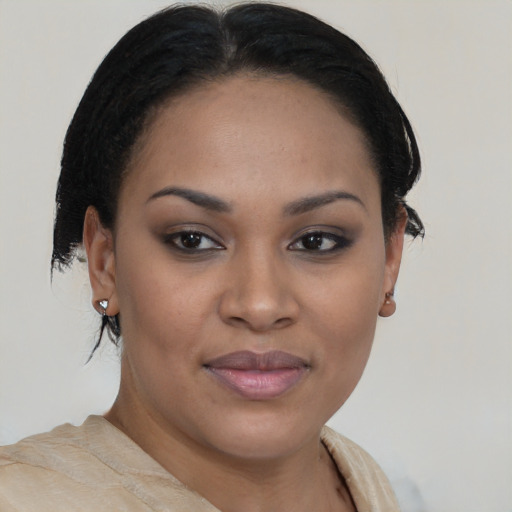 Joyful black young-adult female with medium  brown hair and brown eyes