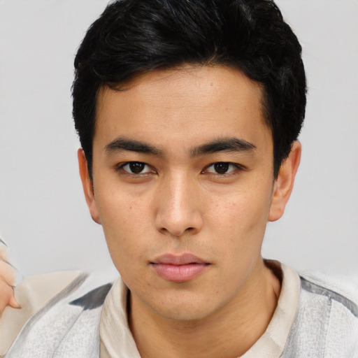 Neutral latino young-adult male with short  brown hair and brown eyes
