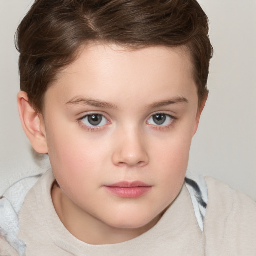 Joyful white child female with short  brown hair and grey eyes