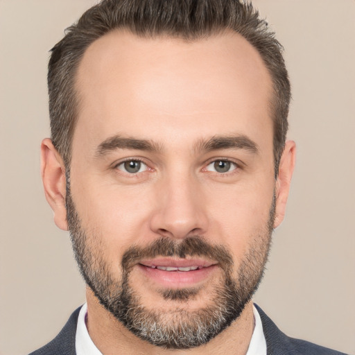 Joyful white adult male with short  brown hair and brown eyes