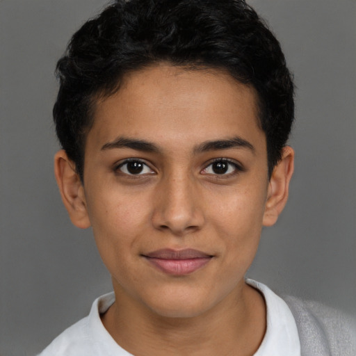 Joyful latino young-adult female with short  brown hair and brown eyes