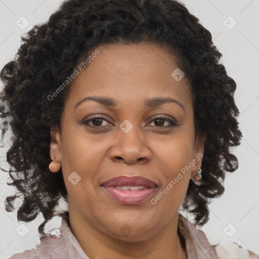 Joyful black adult female with medium  brown hair and brown eyes