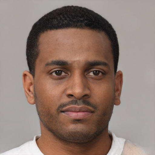 Neutral latino young-adult male with short  brown hair and brown eyes