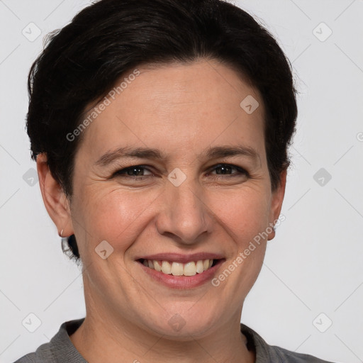 Joyful white adult female with short  brown hair and brown eyes