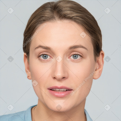 Joyful white young-adult female with short  brown hair and grey eyes