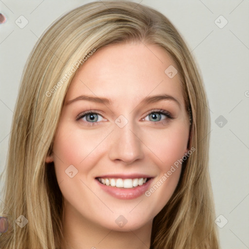 Joyful white young-adult female with long  brown hair and blue eyes