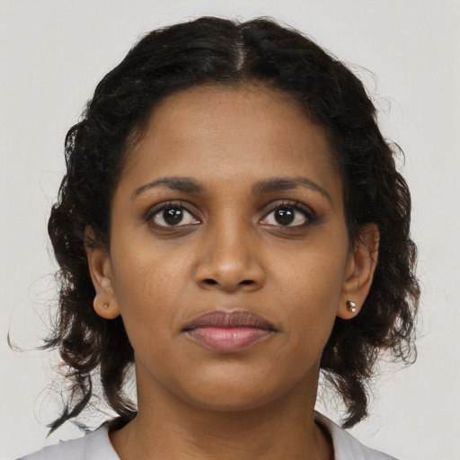 Neutral black young-adult female with medium  brown hair and brown eyes