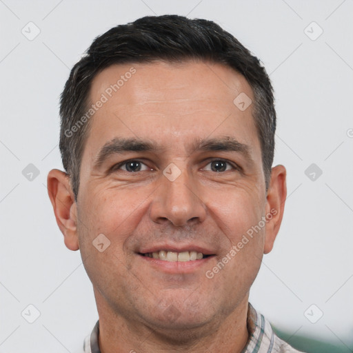 Joyful white adult male with short  brown hair and brown eyes