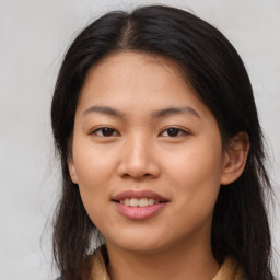 Joyful asian young-adult female with long  brown hair and brown eyes