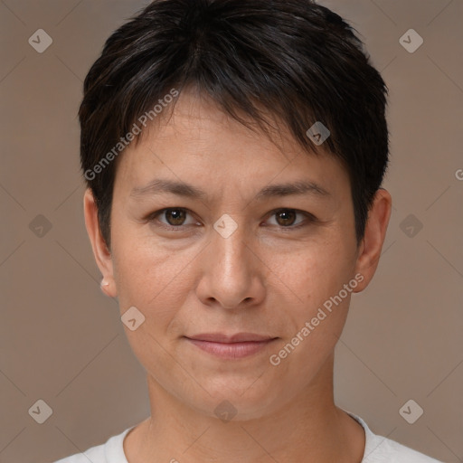 Joyful white adult female with short  brown hair and brown eyes