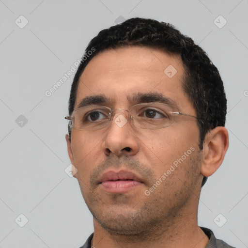 Neutral white adult male with short  black hair and brown eyes