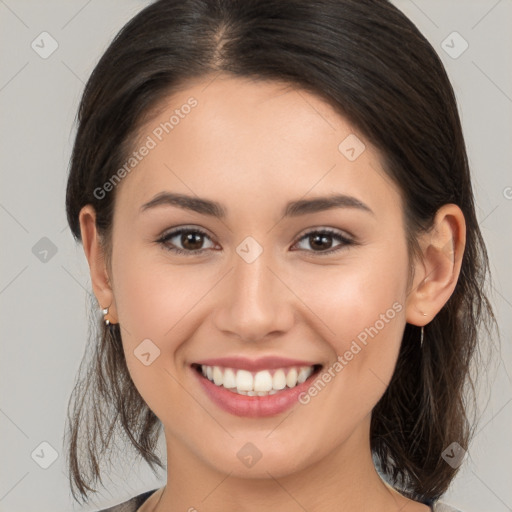 Joyful white young-adult female with medium  brown hair and brown eyes