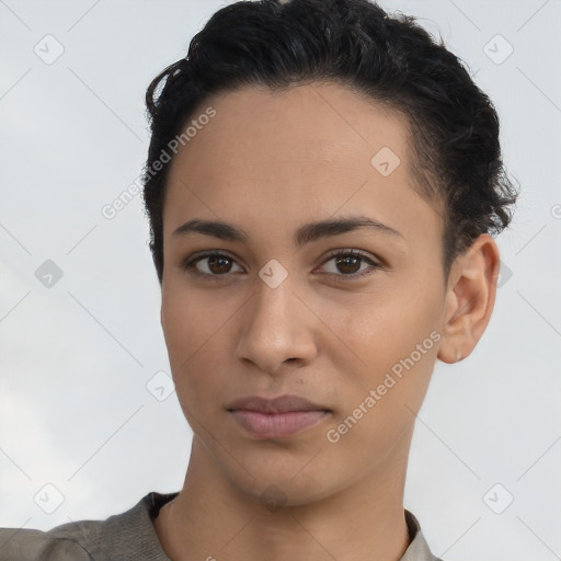 Joyful latino young-adult female with short  brown hair and brown eyes