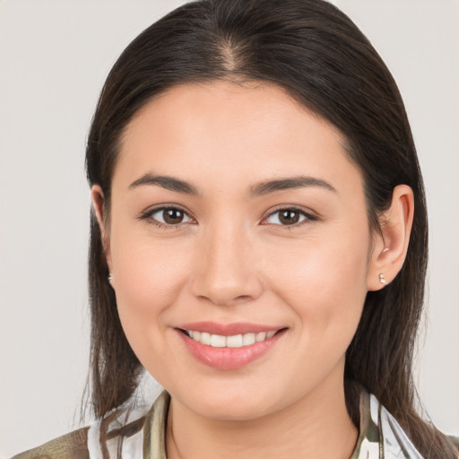 Joyful white young-adult female with medium  brown hair and brown eyes