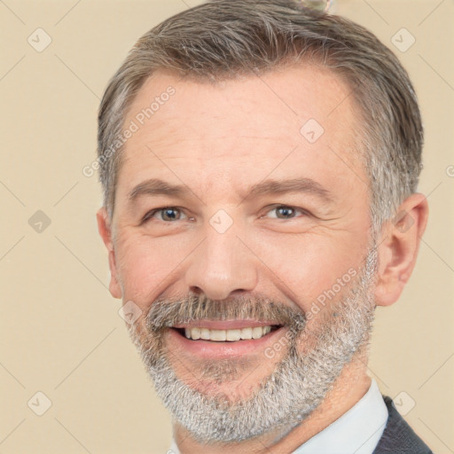 Joyful white middle-aged male with short  brown hair and brown eyes