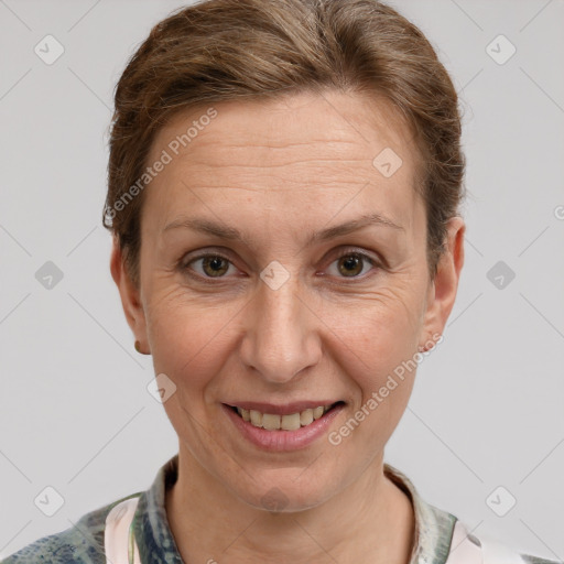 Joyful white adult female with short  brown hair and grey eyes