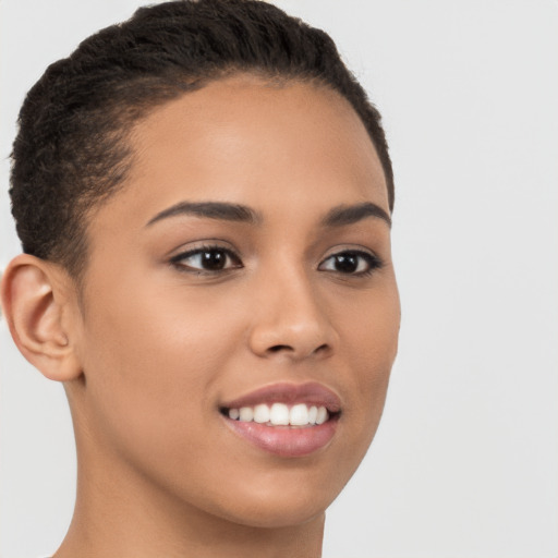 Joyful latino young-adult female with short  brown hair and brown eyes