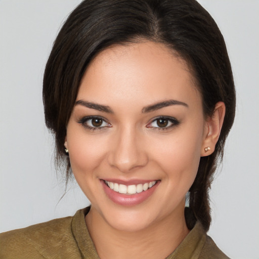 Joyful white young-adult female with medium  brown hair and brown eyes