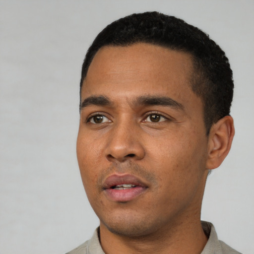 Neutral latino young-adult male with short  black hair and brown eyes
