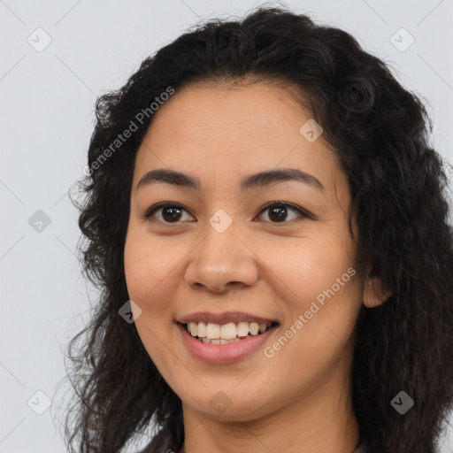 Joyful latino young-adult female with long  brown hair and brown eyes