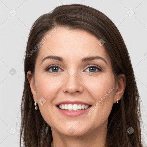 Joyful white young-adult female with long  brown hair and grey eyes