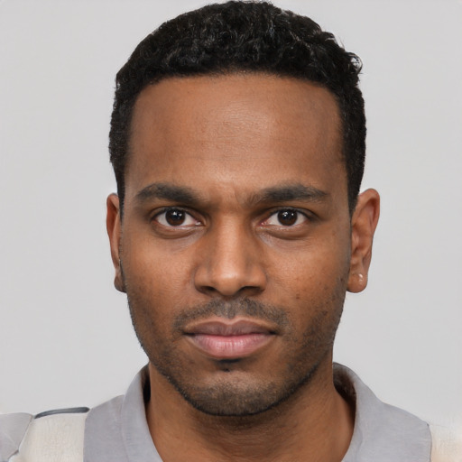 Neutral black young-adult male with short  black hair and brown eyes