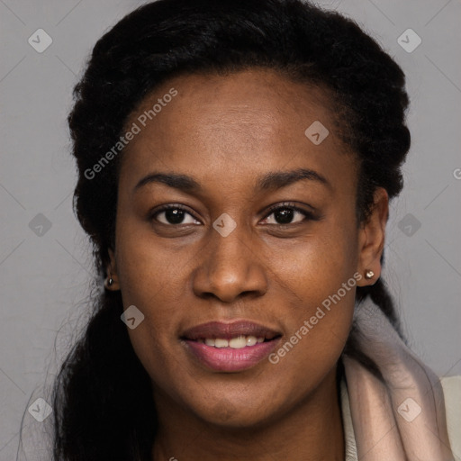 Joyful black young-adult female with long  brown hair and brown eyes