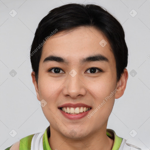 Joyful asian young-adult male with short  black hair and brown eyes