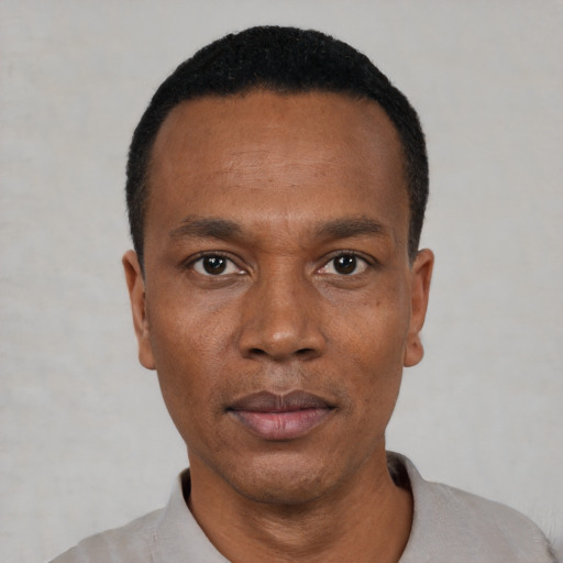 Neutral black adult male with short  black hair and brown eyes