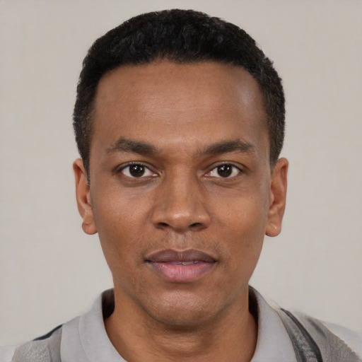 Neutral black young-adult male with short  black hair and brown eyes