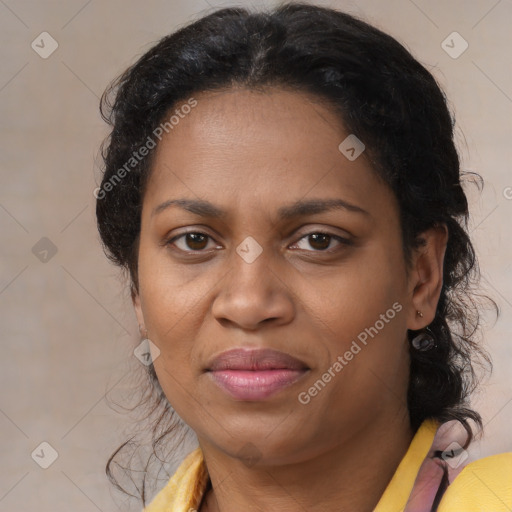 Joyful latino adult female with medium  brown hair and brown eyes