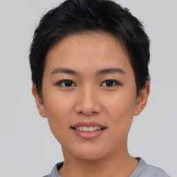 Joyful asian young-adult female with short  brown hair and brown eyes